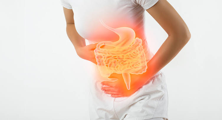 Illustration of the gut microbiome showing healthy vs disrupted bacterial balance